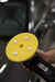Round burnishing pad on a floor polisher