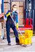 Janitorial staff cleaning a warehouse floor