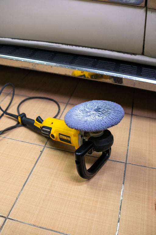 Electric floor burnisher on tile floor