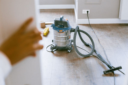 Industrial wet/dry shop vacuum on a floor