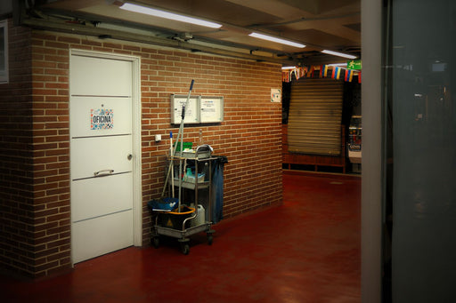 Industrial cleaning cart setup in a commercial hallway