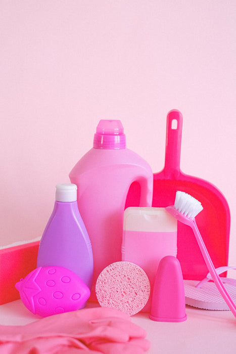 Bottles of cleaning supplies arranged for a cleaning routine